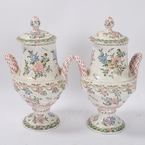 82 - Pair of late 19th/early 20th century French faience lidded vases, each finely painted with romantic ... 