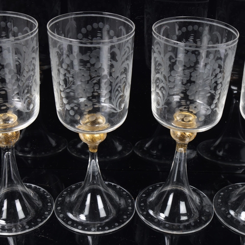 84 - 2 sets of 8 Venetian wine glasses, each with engraved bowl, gilt knopped stem and trumpet foot, tall... 