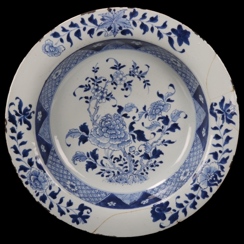 87 - Large Chinese 18th century blue and white porcelain bowl, with painted flowers, diameter 39.5cm (A/F... 