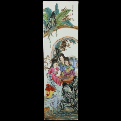 88 - A Chinese porcelain plaque, depicting ladies playing Go, text inscription, 76.5cm x 22.5cm