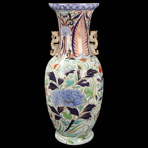 93 - Large Chinese porcelain vase with dragon handles and relief moulded body, height 58cm