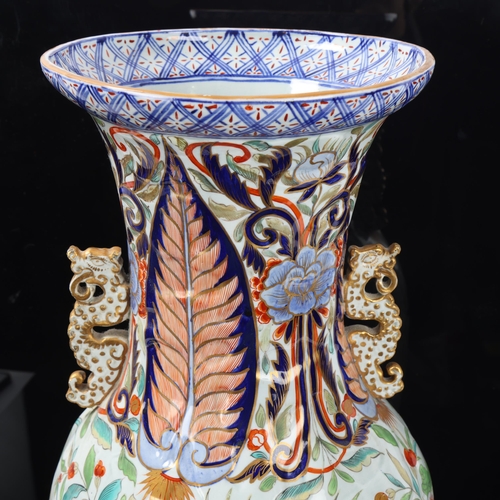 93 - Large Chinese porcelain vase with dragon handles and relief moulded body, height 58cm