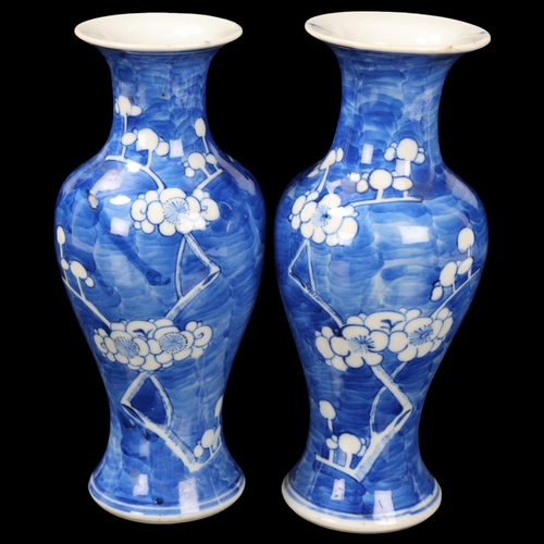 97 - Pair of Chinese blue and white porcelain prunus design baluster vases, 4 character marks, height 20c... 