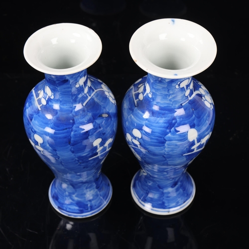 97 - Pair of Chinese blue and white porcelain prunus design baluster vases, 4 character marks, height 20c... 