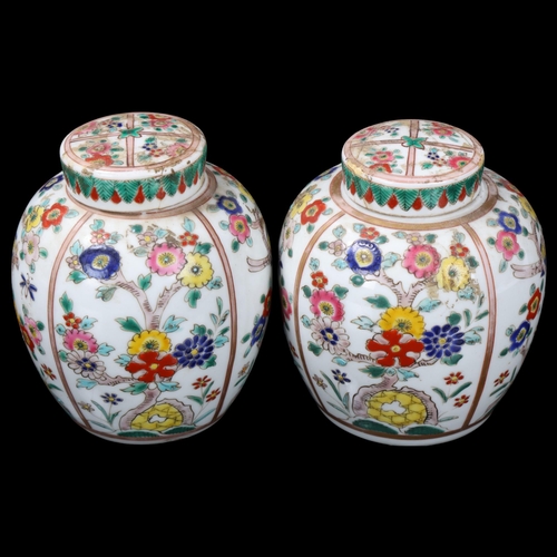 98 - Pair of 19th century porcelain jars and covers, with enamelled birds and flowers, height 10.5cm