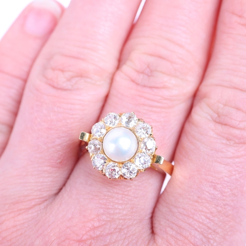 1200 - An 18ct gold whole button pearl and diamond flowerhead cluster ring, set with 6.9mm pearl surrounded... 