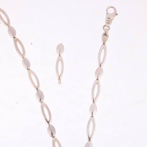 1693 - A sterling silver oval link chain necklace and bracelet set, necklace 42cm, bracelet 16cm, 44.2g tot... 