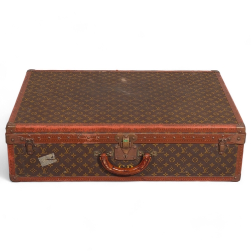 165 - LOUIS VUITTON - hard suitcase/trunk with monogram fabric cover and straps to edges and brass mounts ... 