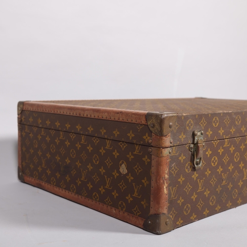 166 - LOUIS VUITTON - hard suitcase/trunk with monogram fabric cover, strapping to corners and brass locks... 