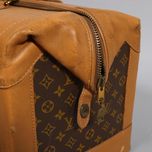 169 - LOUIS VUITTON - Gladstone style bag with monogrammed fabric and tan leather, circa 1980s, brown cott... 