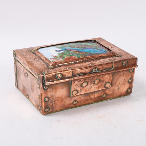 180 - A 19th century Arts and Crafts handmade copper covered box, with enamel top panel depicting peacock,... 