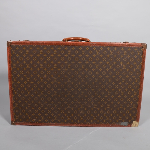 165 - LOUIS VUITTON - hard suitcase/trunk with monogram fabric cover and straps to edges and brass mounts ... 