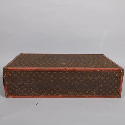 165 - LOUIS VUITTON - hard suitcase/trunk with monogram fabric cover and straps to edges and brass mounts ... 