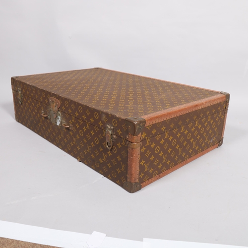 166 - LOUIS VUITTON - hard suitcase/trunk with monogram fabric cover, strapping to corners and brass locks... 