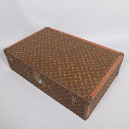 166 - LOUIS VUITTON - hard suitcase/trunk with monogram fabric cover, strapping to corners and brass locks... 