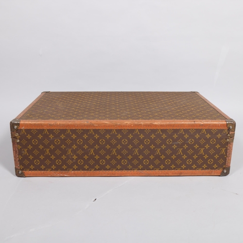 166 - LOUIS VUITTON - hard suitcase/trunk with monogram fabric cover, strapping to corners and brass locks... 