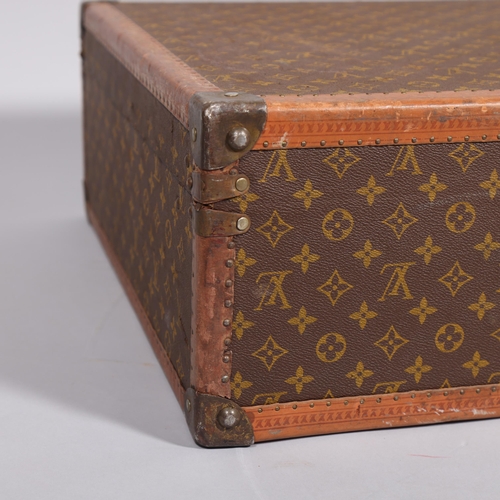 166 - LOUIS VUITTON - hard suitcase/trunk with monogram fabric cover, strapping to corners and brass locks... 