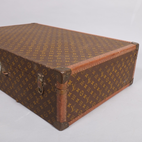 166 - LOUIS VUITTON - hard suitcase/trunk with monogram fabric cover, strapping to corners and brass locks... 