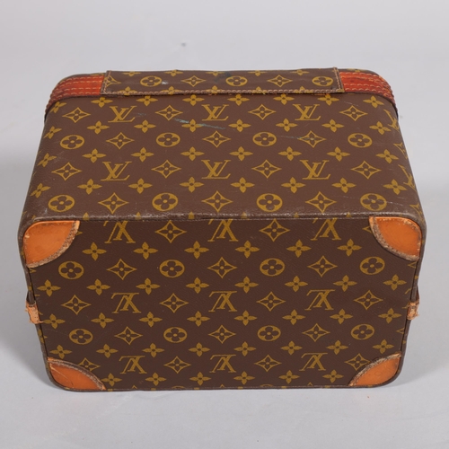 168 - LOUIS VUITTON - a vanity case with monogrammed fabric and cotton interior, brown leather edging and ... 