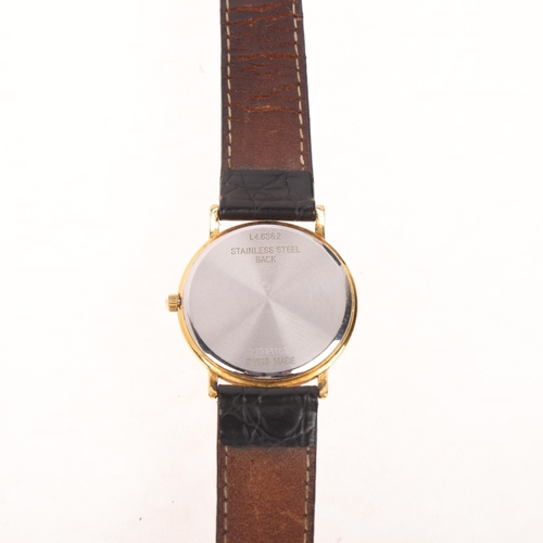 1029 - LONGINES - a gold plated stainless steel quartz calendar wristwatch, ref. L4.636.2, champagne dial w... 