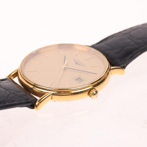 1029 - LONGINES - a gold plated stainless steel quartz calendar wristwatch, ref. L4.636.2, champagne dial w... 