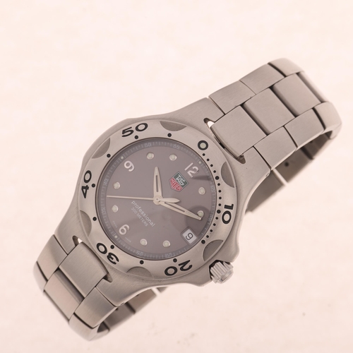 1037 - TAG HEUER - a stainless steel Kirium Professional 200M quartz calendar bracelet watch, ref. WL1111-0... 