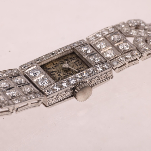 1058 - An Art Deco lady's French platinum diamond mechanical cocktail wristwatch, circa 1930s, silvered dia... 