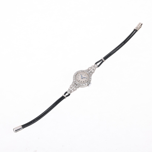 1060 - A lady's Art Deco platinum diamond mechanical cocktail wristwatch, circa 1930s, silvered dial with b... 