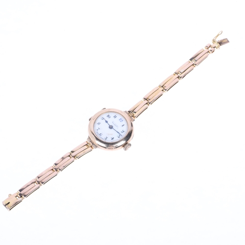 1064 - An early 20th century lady's 9ct gold mechanical bracelet watch, white enamel dial with hand painted... 