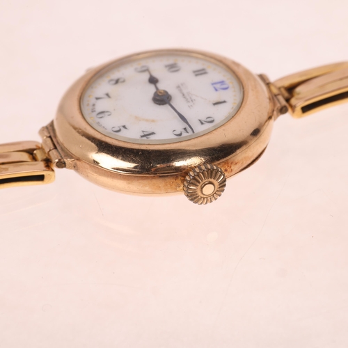 1064 - An early 20th century lady's 9ct gold mechanical bracelet watch, white enamel dial with hand painted... 