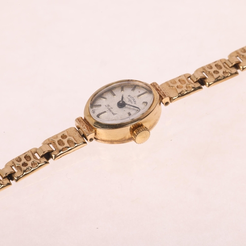 1065 - ROTARY - a lady's 9ct gold mechanical bracelet watch, circa 1960s, silvered brushed dial with applie... 