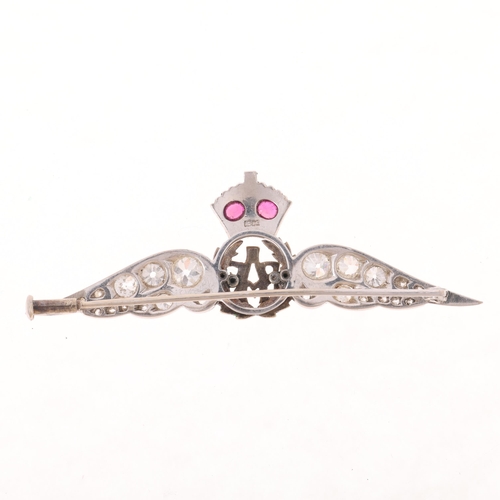 1184 - A large 18ct white gold ruby diamond and enamel RAF wings sweetheart brooch, circa 1930, set with ol... 