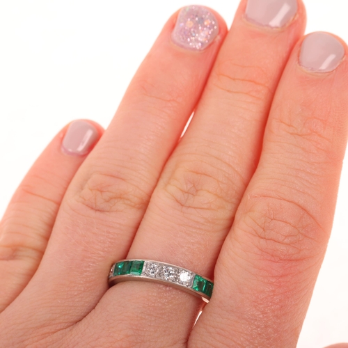 1185 - An 18ct white gold emerald and diamond half eternity ring, maker HB&S, London 1974, channel set with... 