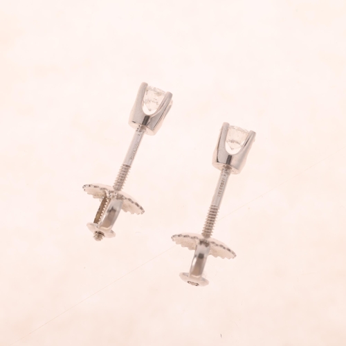 1189 - A pair of 18ct white gold 0.3ct single stone diamond stud earrings, maker IKS, each set with 0.15ct ... 