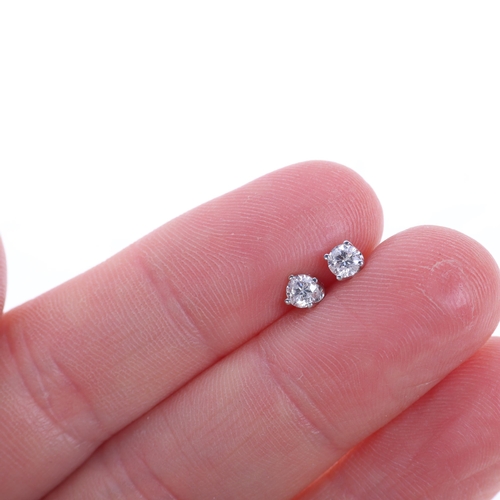 1189 - A pair of 18ct white gold 0.3ct single stone diamond stud earrings, maker IKS, each set with 0.15ct ... 