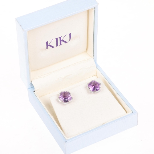 1190 - KIKI MCDONOUGH - a pair of 18ct white gold amethyst and diamond flowerhead stud earrings, each set w... 