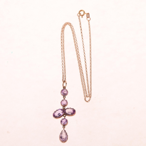 1191 - An Edwardian 9ct rose gold amethyst drop pendant necklace, cut-down collet set with oval and round-c... 