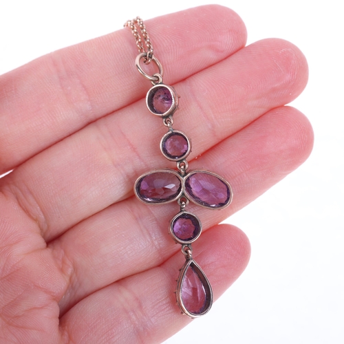 1191 - An Edwardian 9ct rose gold amethyst drop pendant necklace, cut-down collet set with oval and round-c... 