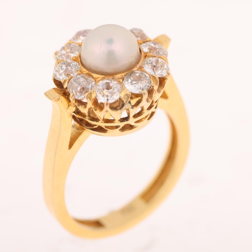 1200 - An 18ct gold whole button pearl and diamond flowerhead cluster ring, set with 6.9mm pearl surrounded... 