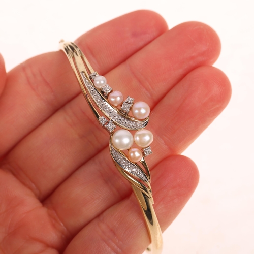 1202 - A 9ct gold cultured pearl and diamond hinged bangle, maker LD Ltd, import Sheffield 1988, setting he... 