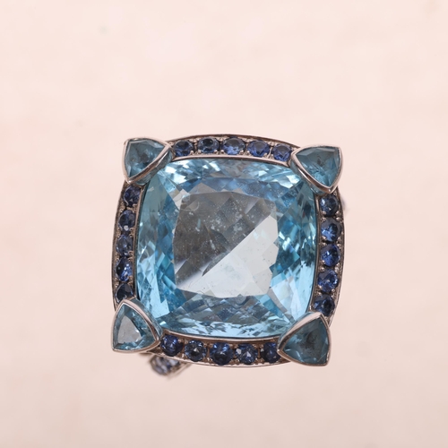 1206 - A large 18ct white gold blue topaz and sapphire cluster cocktail ring, set with square cushion and t... 