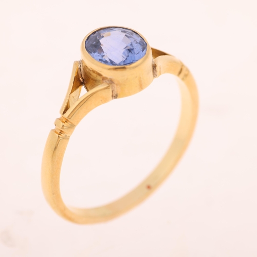 1210 - An 18ct gold single stone Ceylon sapphire ring, Sheffield 1995, rub-over set with 1.7ct oval mixed-c... 