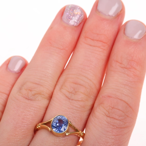 1210 - An 18ct gold single stone Ceylon sapphire ring, Sheffield 1995, rub-over set with 1.7ct oval mixed-c... 