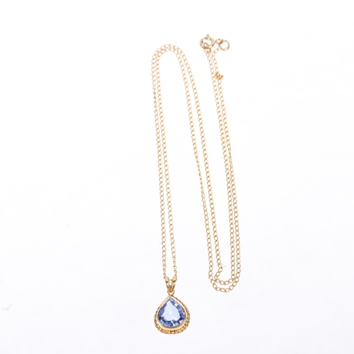 1211 - An 18ct gold single stone Ceylon sapphire drop pendant necklace, rub-over set with 2.15ct pear-cut s... 