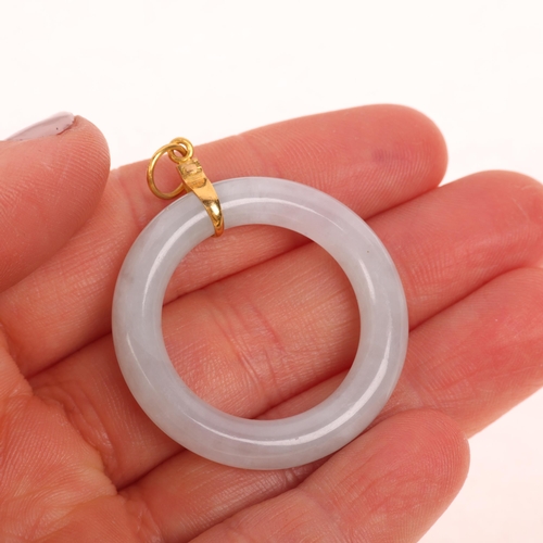 1217 - A Chinese jade hololith ring pendant, with unmarked 18ct gold mount, 35.2mm, 8.4g