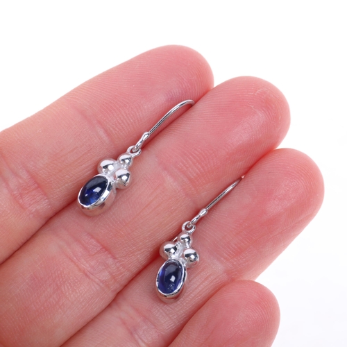 1219 - JANE M WATLING - a pair of 18ct white gold sapphire drop earrings, maker JMW, London 1999, set with ... 