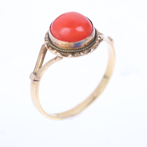 1223 - An 18ct gold single stone coral dress ring, rub-over set with round cabochon coral, setting height 1... 