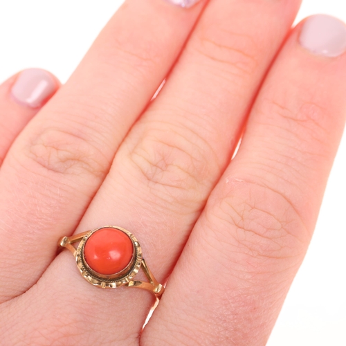 1223 - An 18ct gold single stone coral dress ring, rub-over set with round cabochon coral, setting height 1... 