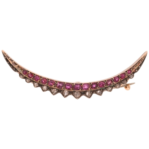 1224 - A Victorian ruby and diamond crescent brooch, circa 1890, set with oval mixed-cut rubies and rose-cu... 