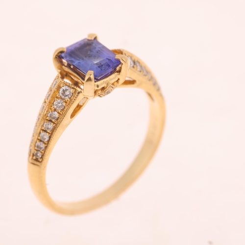 1260 - An 18ct gold tanzanite and diamond ring set with octagonal step-cut tanzanite and modern round brill... 